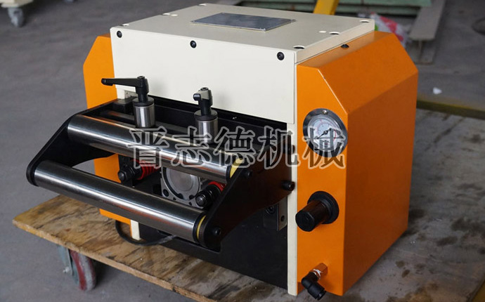 改進(jìn)后的NC送料機